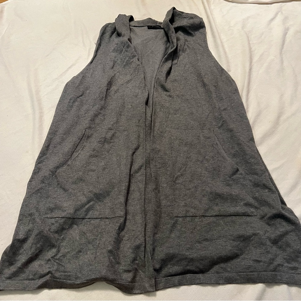 Womens sleeveless hooded vest with pockets.